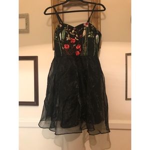 Embroidered black cocktail dress.
